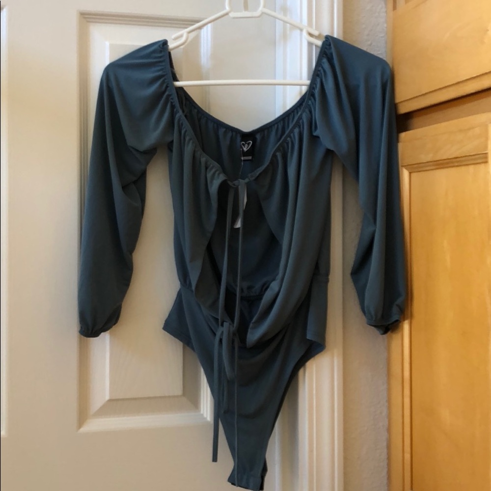 Teal blue bodysuit 1/4 length sleeves. Tie front.
